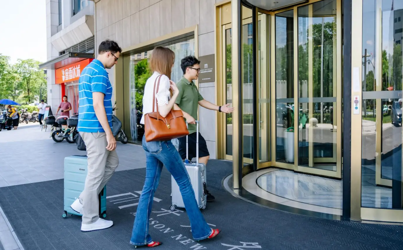 Professional business traveler walking with carry-on luggage